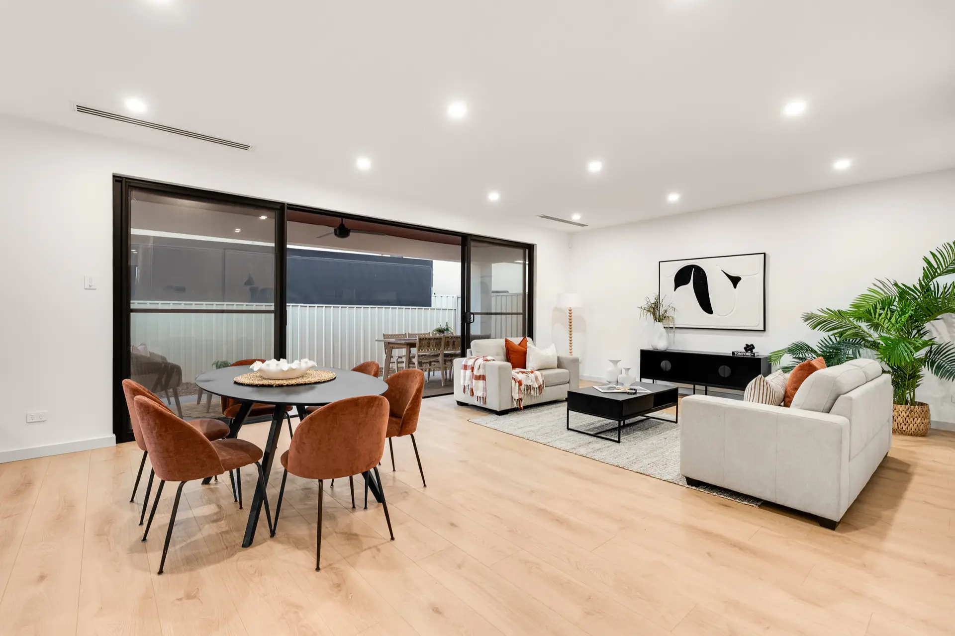 Living and dining room opening to the alfresco area.