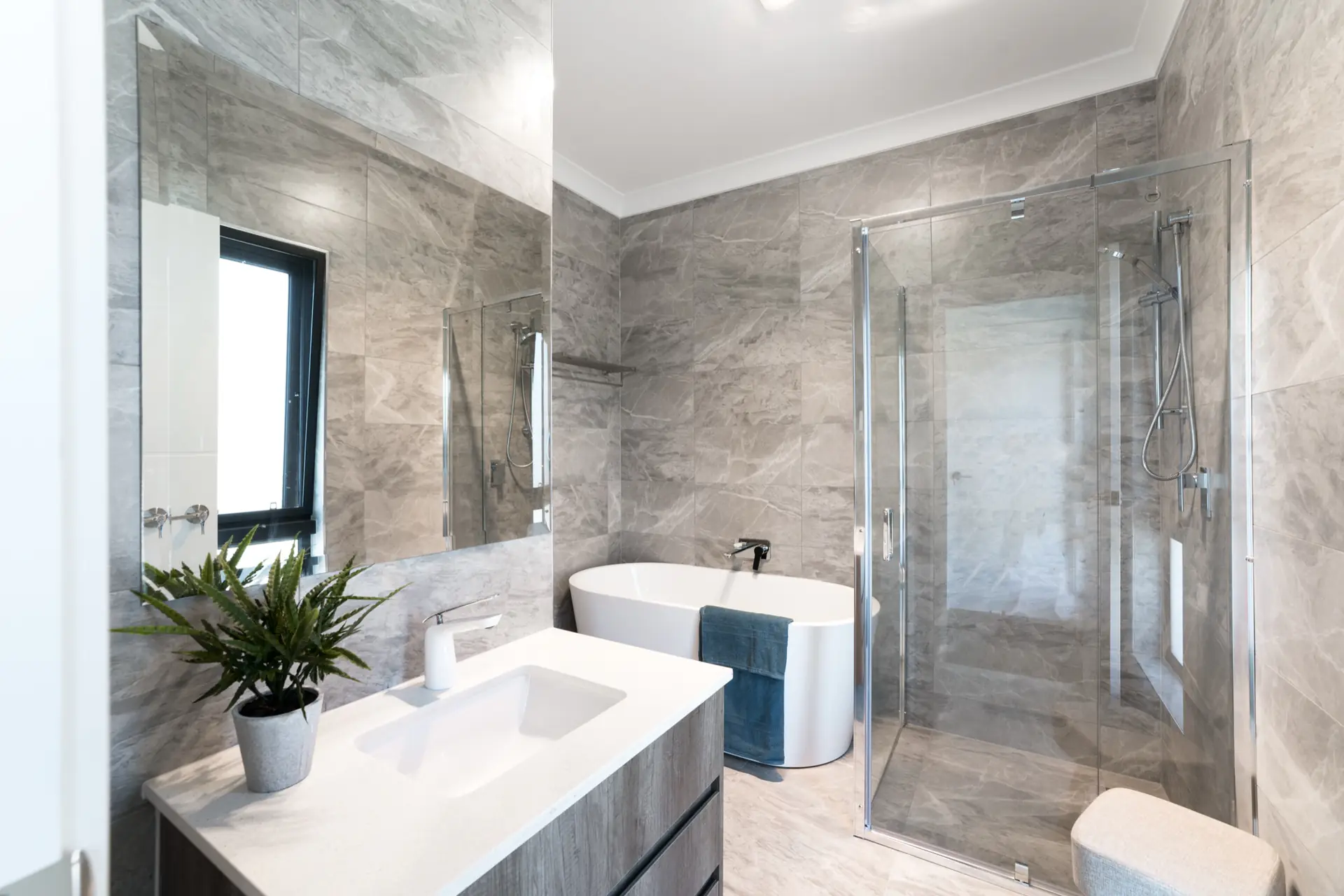 Limbert Avenue Seacombe Gardens bathroom with grey tile and white vanity.