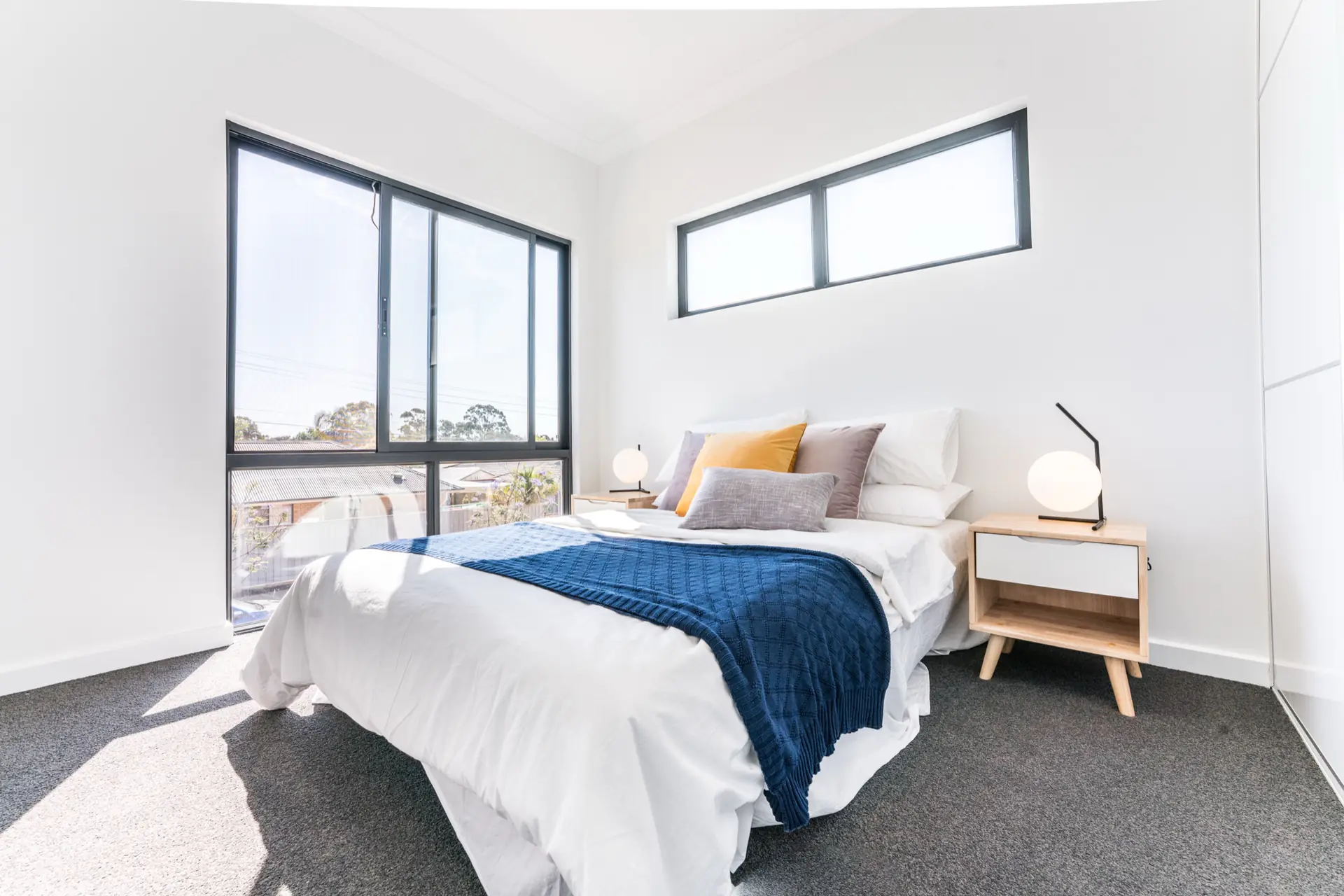 Limbert Avenue Seacombe Gardens bedroom with black-framed window and soft styling.